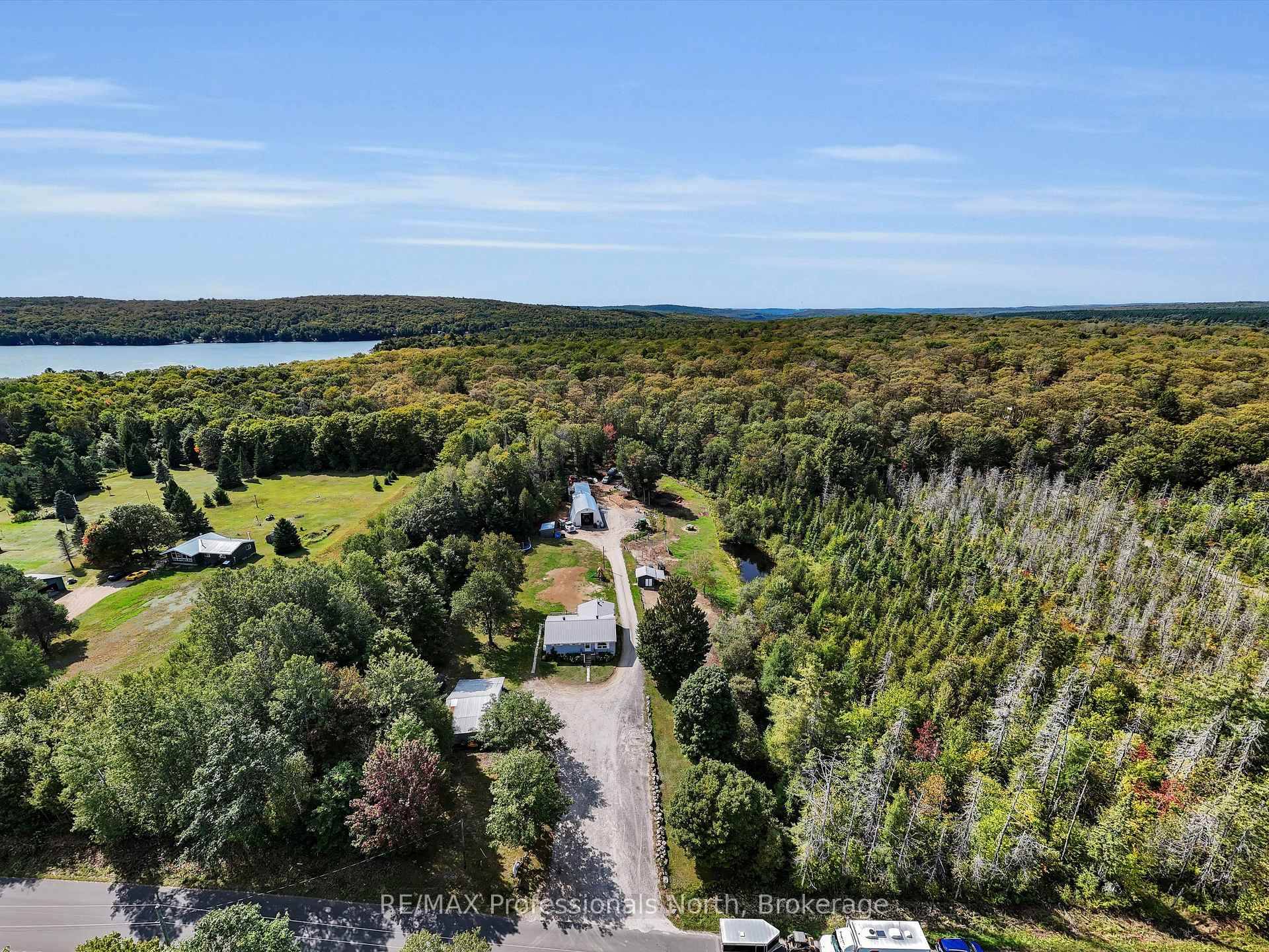Tucked away on nearly 9. 8 acres of hardwood trees, this charming family home is the perfect escape to country living.