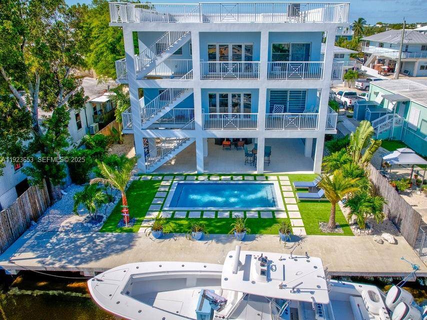 Experience the pinnacle of coastal luxury in this brand new waterfront residence in Key Largo.