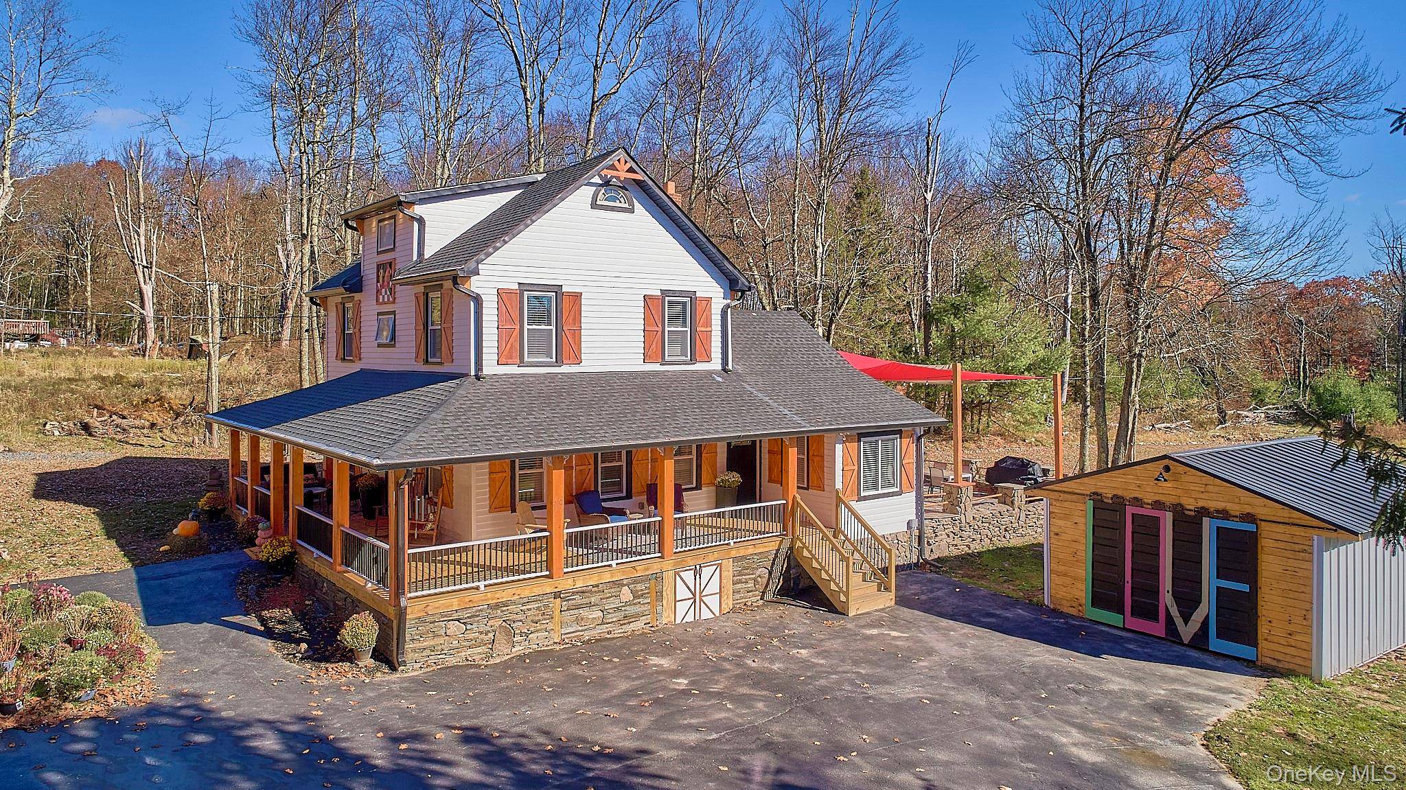 Experience the charm of this beautifully renovated farmhouse on Cold Spring Road, where a spacious wraparound porch, a sprawling backyard, and an adorable pond welcome you home.