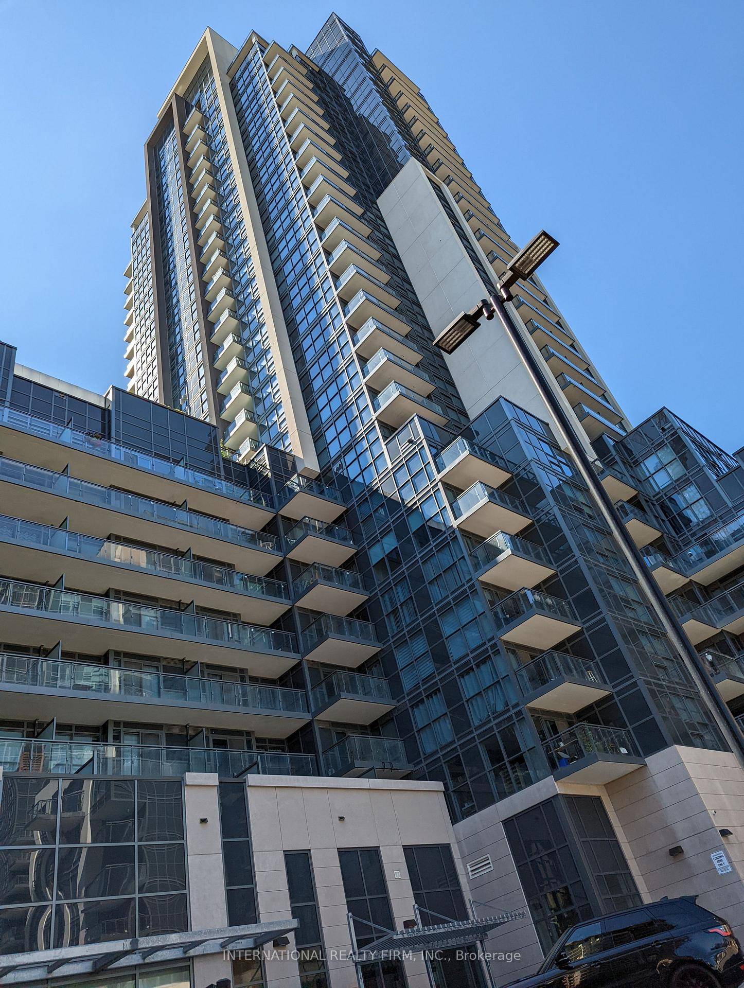 Luxury Condo With Granite Countertops, Hardwood Flooring, Upgraded Soft Close Kitchen Cabinetry.