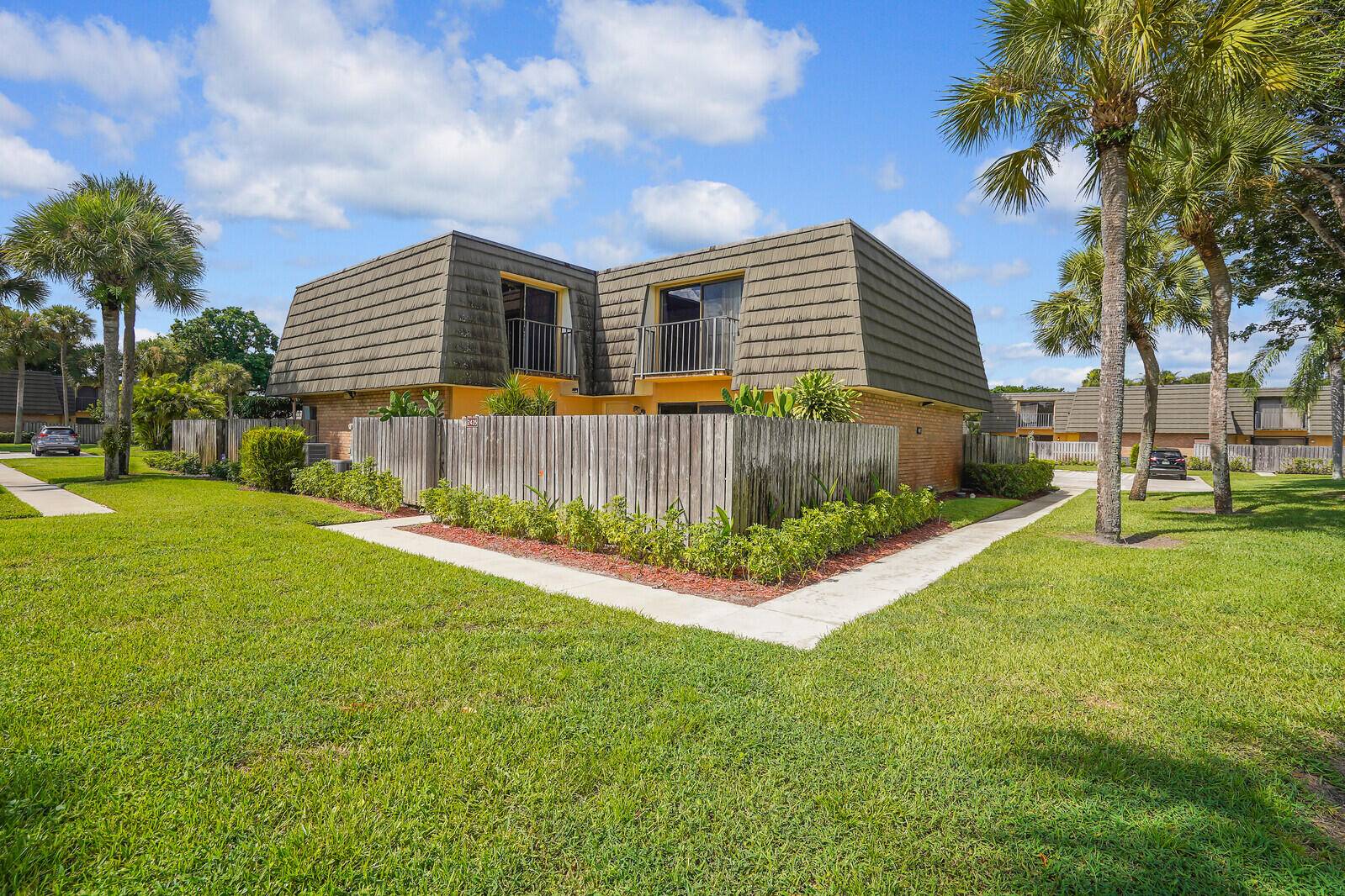 Functional 2 bed, 2 bath townhome with 1, 236 sq ft in the desirable Village of Sandalwood Lakes centrally located in West Palm Beach.