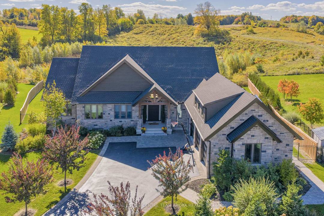 Welcome to 23 Whitcombe Way, Puslinch, a stunning custom built bungalow that seamlessly blends modern grandeur with serene countryside charm.