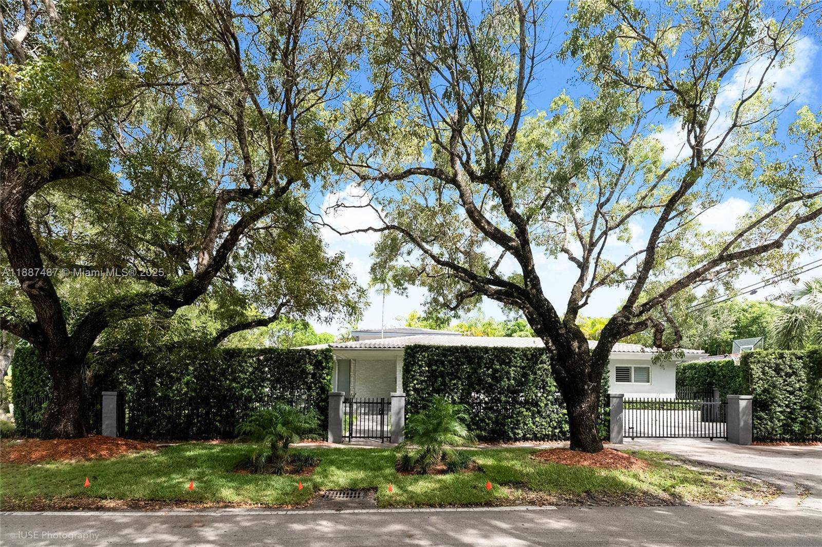 Set on a picturesque tree lined street, this beautifully remodeled CORNER residence in the heart of Coral Gables offers both timeless charm and exceptional privacy.