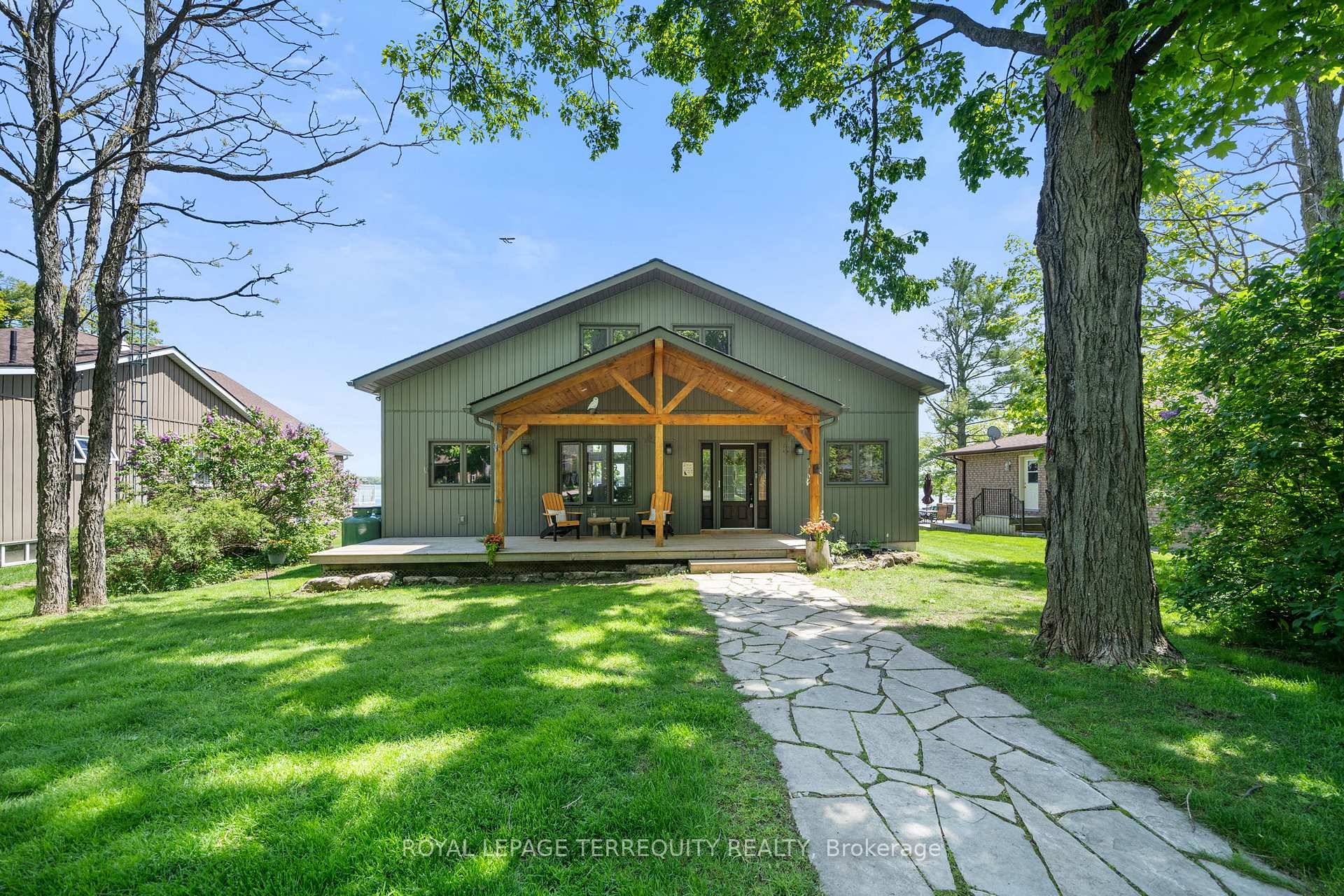 This Exquisite Year Round Waterfront Home On Cameron Lake Offers Unparalleled Lakeside Living !