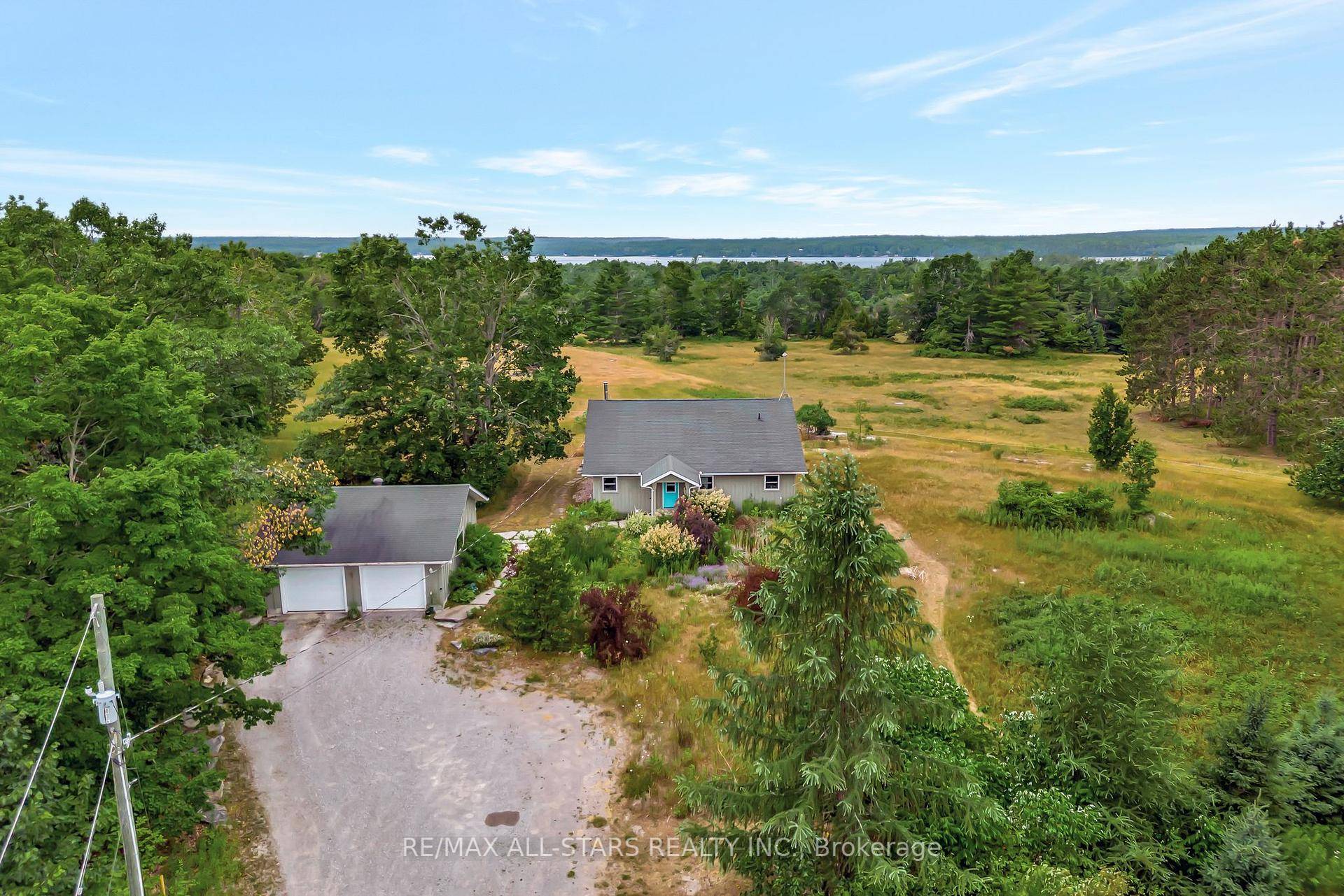 Discover this beautifully maintained bungalow, built in 2009, set on a private 6.
