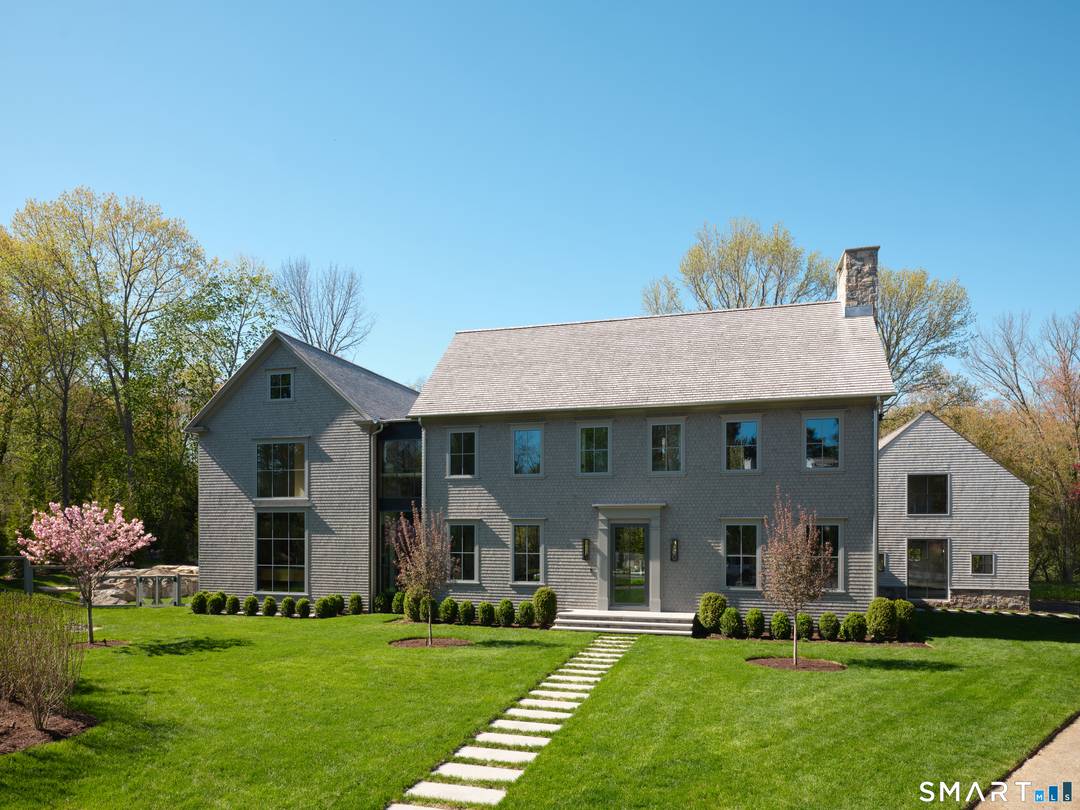 Privately set within Darien's coveted Tokeneke neighborhood, 45 Old Farm is a remarkable custom estate by award winning builder Oliver Wilson.