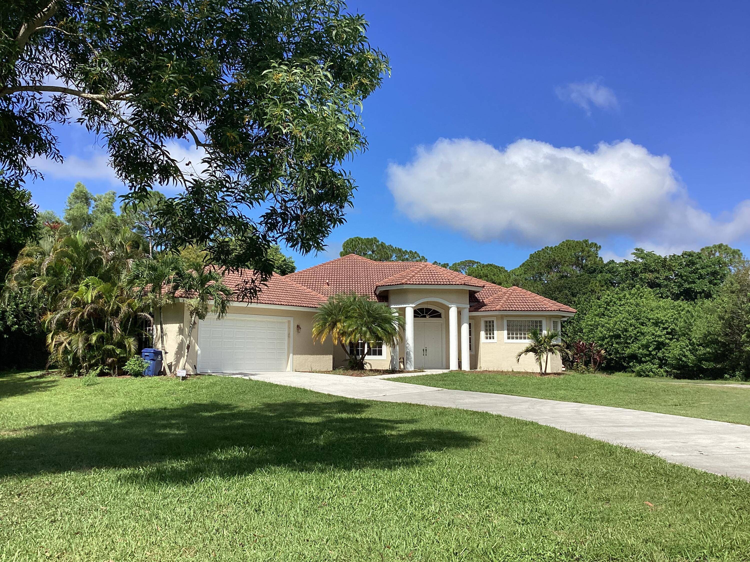 CBS 3 bedroom 2 bath 2. 5 car garage in Jupiter Farms.