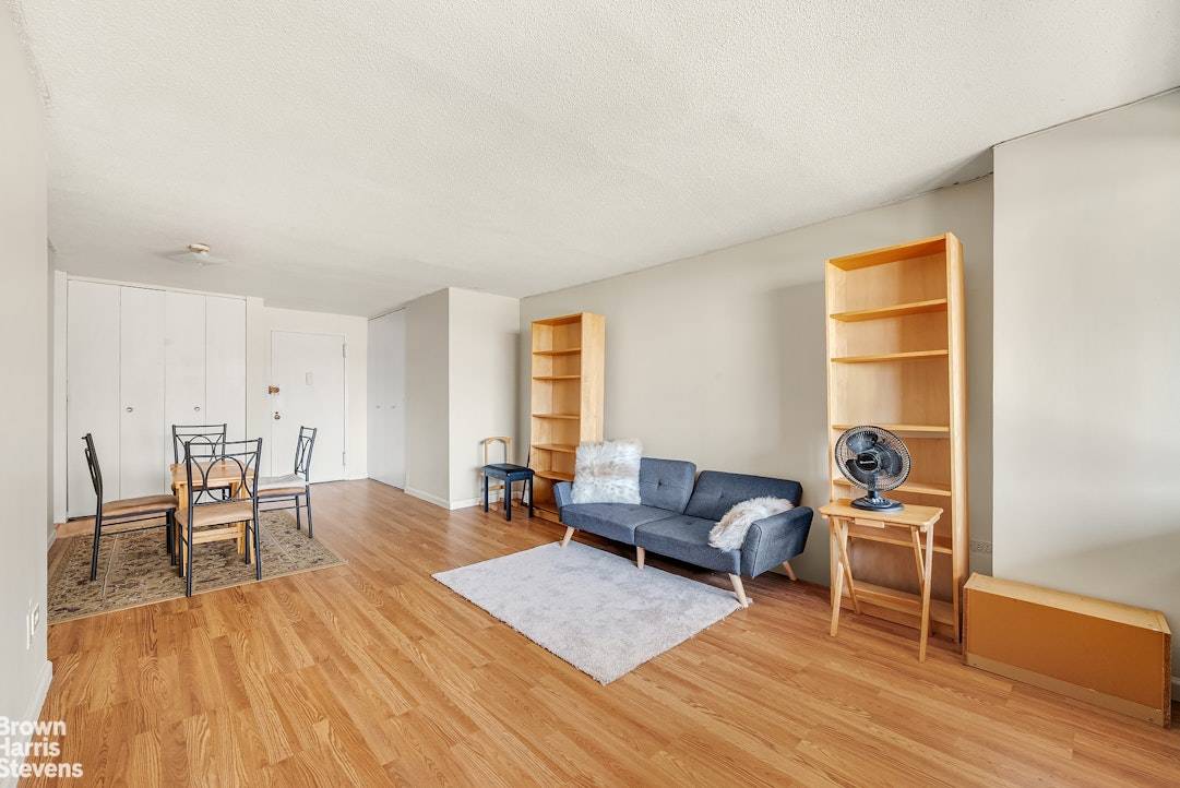 Step into this serene, oversized one bedroom home and you're immediately welcomed by a wall of windows showcasing sweeping views of Manhattan.