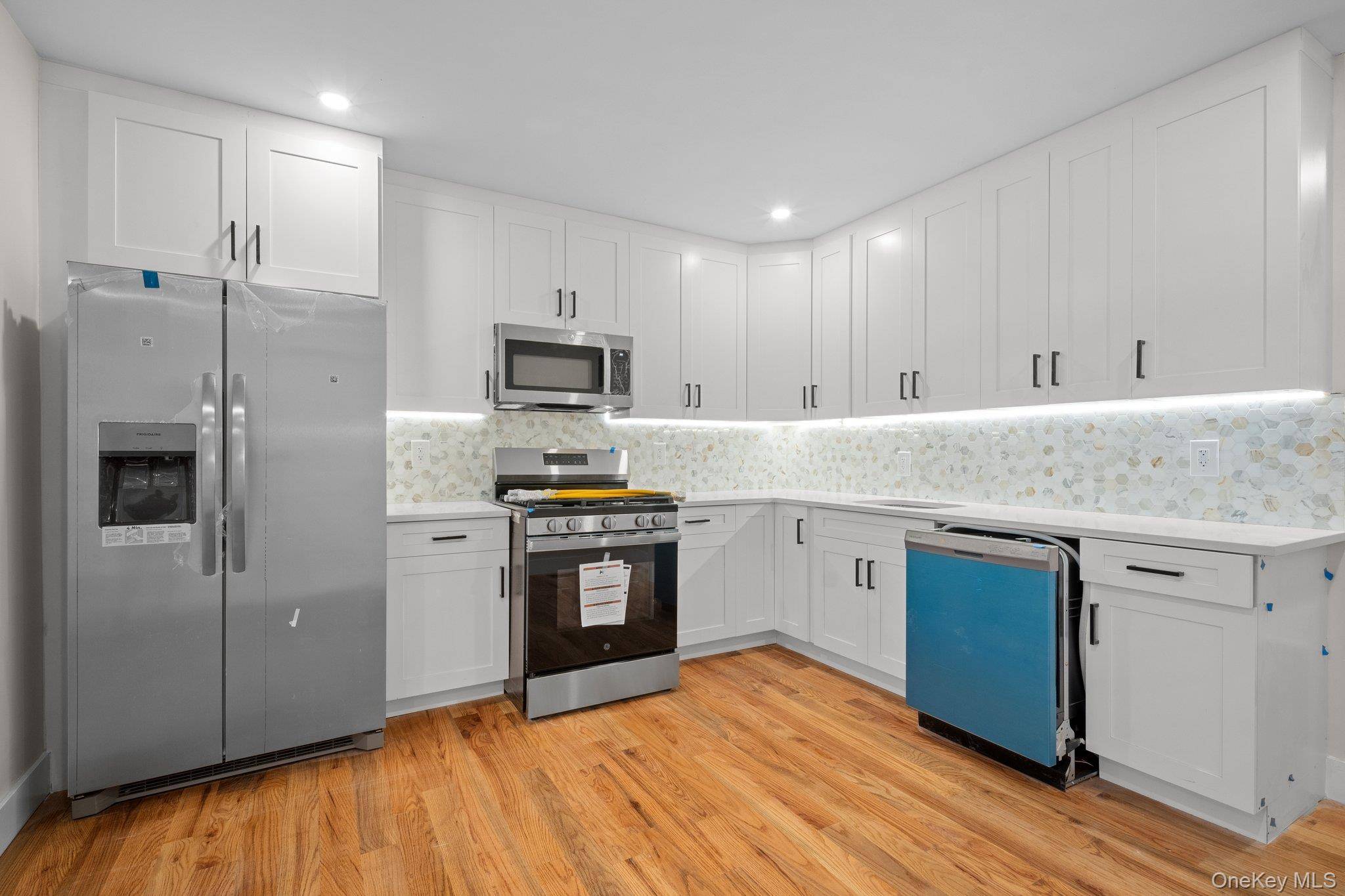 Brand new, custom built two family on a prime corner lot !