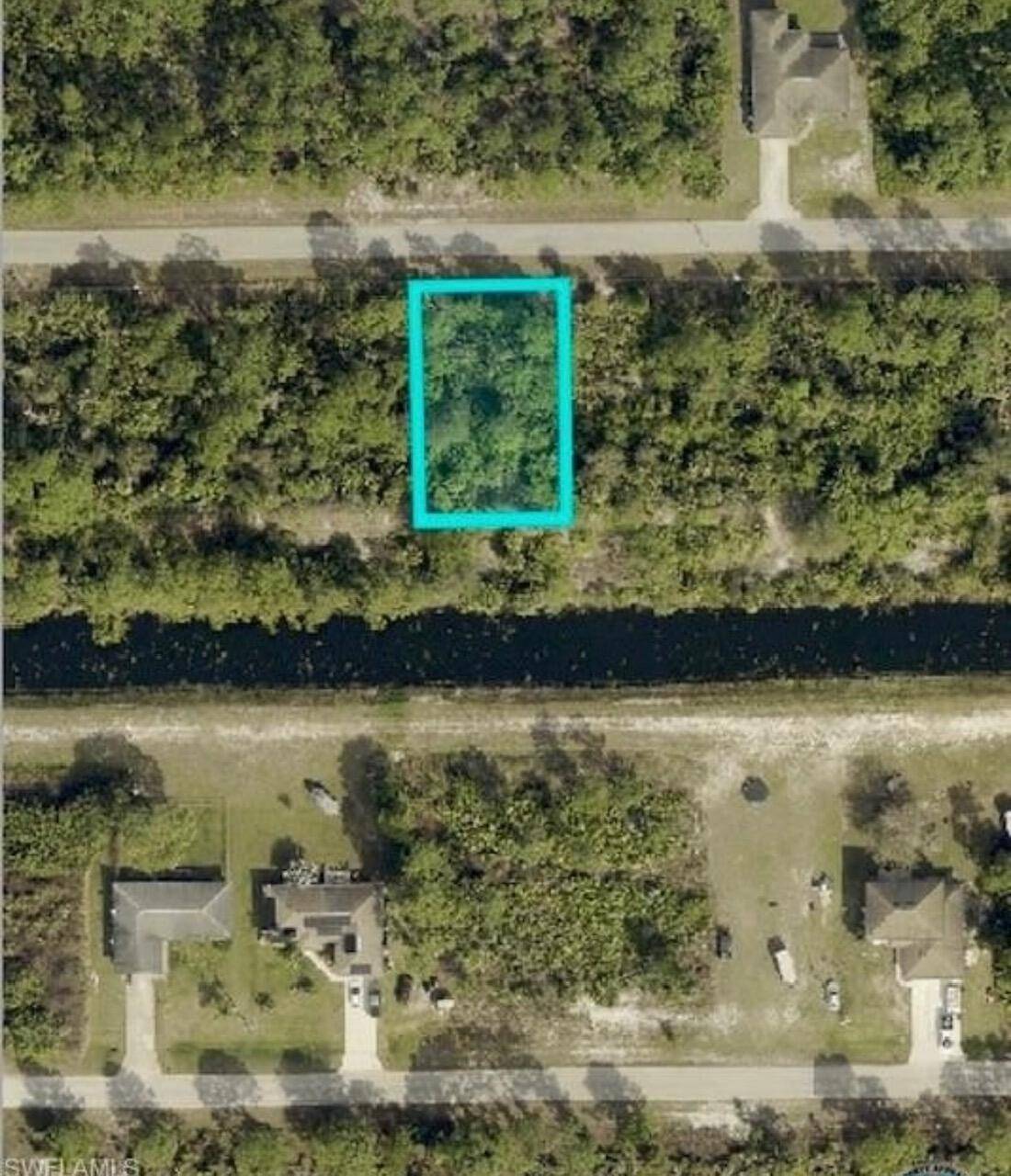 This. 25 acre lot in the east section of Lehigh Acres is high and dry, on a paved road and backs along a canal for extra privacy.
