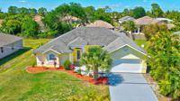 This approximately 2. 000 square foot house features four bedrooms and two bathrooms.