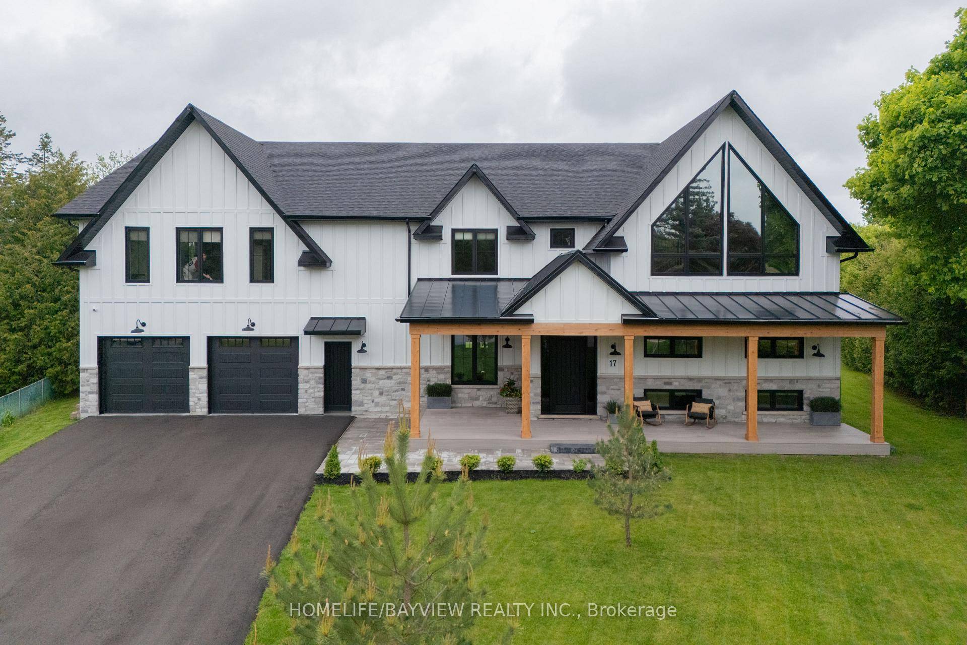 Welcome to 17 Jasmine Crescent a stunning storybook style home that masterfully blends vintage farmhouse charm w contemporary elegance amp ; modern functionality.