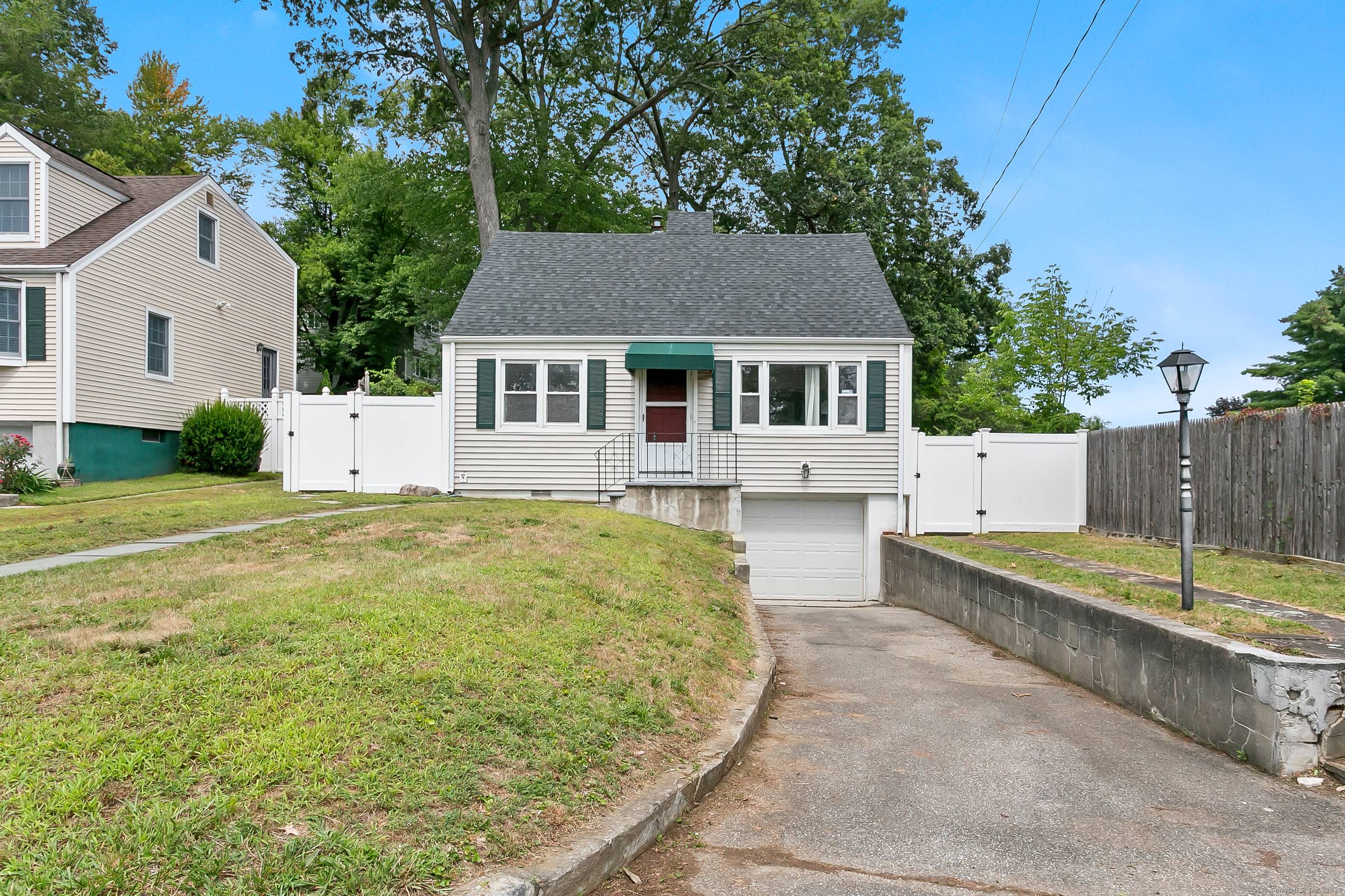Charming Cape Cod home at the end of a quiet cul de sac in Stamford's desirable Mid Ridges.
