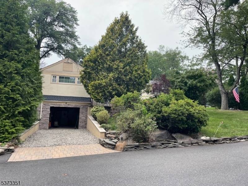 Charming Raised Ranch on a tree lined Cul De Sac.