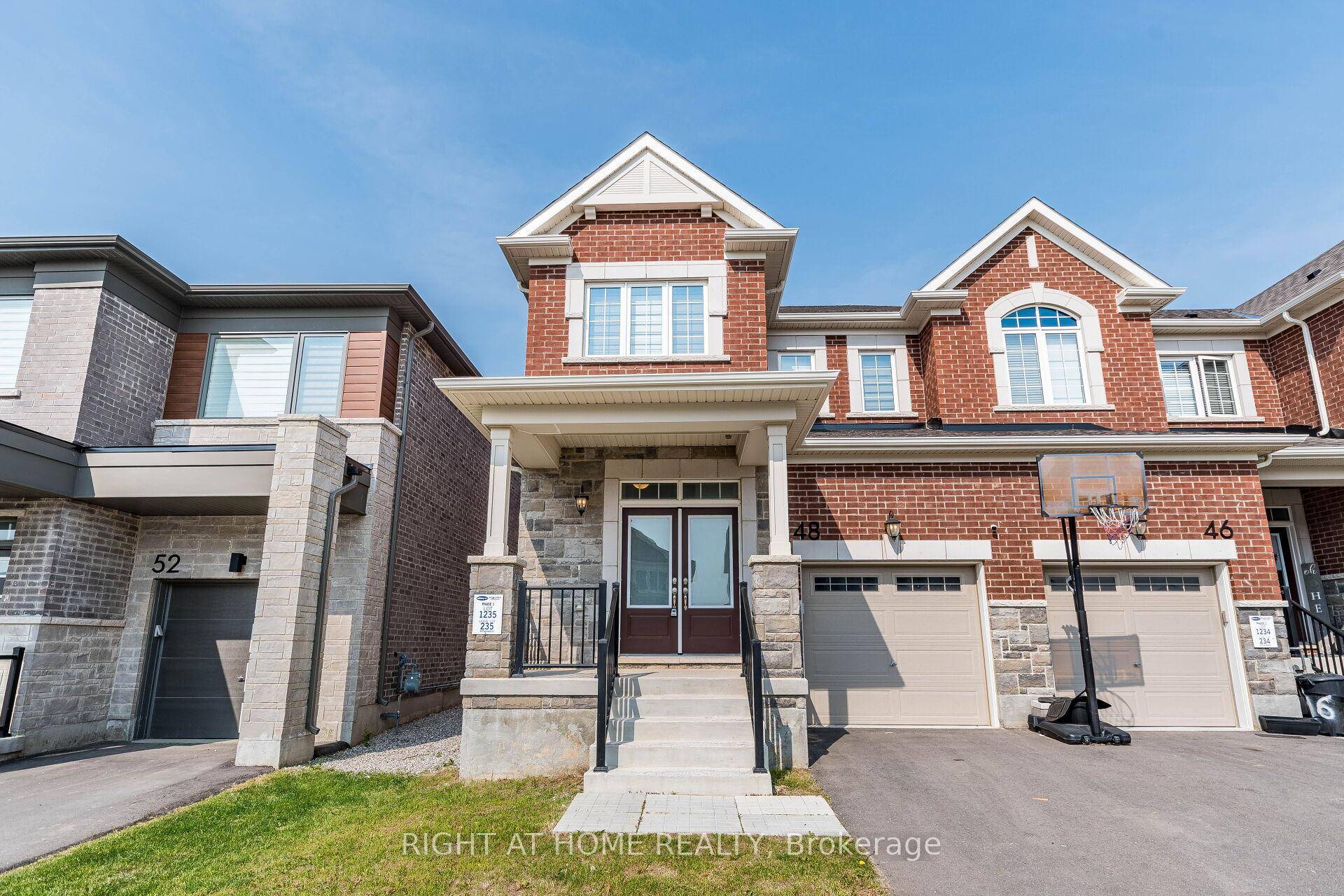 Welcome to this Stunning Executive End Unit Townhome backing onto a vast open green space.