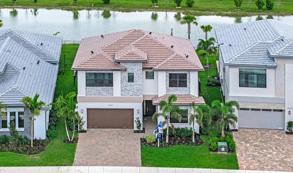 Discover a serene retreat at 13147 Feathering Way, nestled within the sought after community of Palm Beach Gardens.