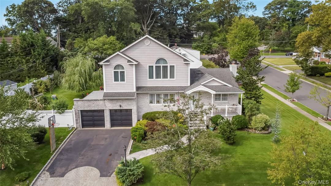 Magnificent, newly renovated one of a kind Victorian style Expanded Ranch, 3, 000 square feet of thoroughly designed living space, situated on quiet block, North Farmingdale, Inc.