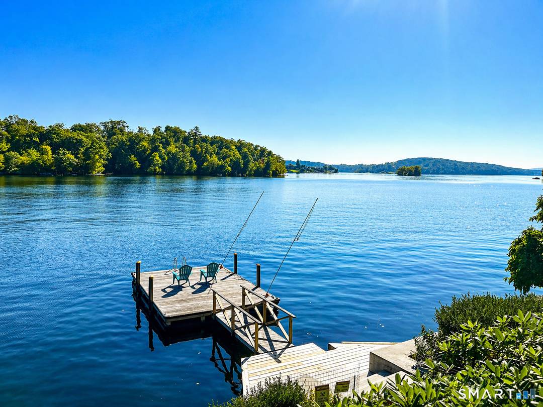 A Candlewood Isle Exclusive Renovated direct waterfront offers an updated 3 BR, 3 Bath open plan with charming outdoor spaces, expansive multi tiered decks and panoramic lake views to the ...