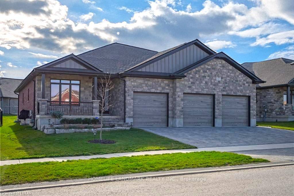 Absolutely stunning, all brick and stone 4 bedroom home, with 5 car garage with drive through to back yard.
