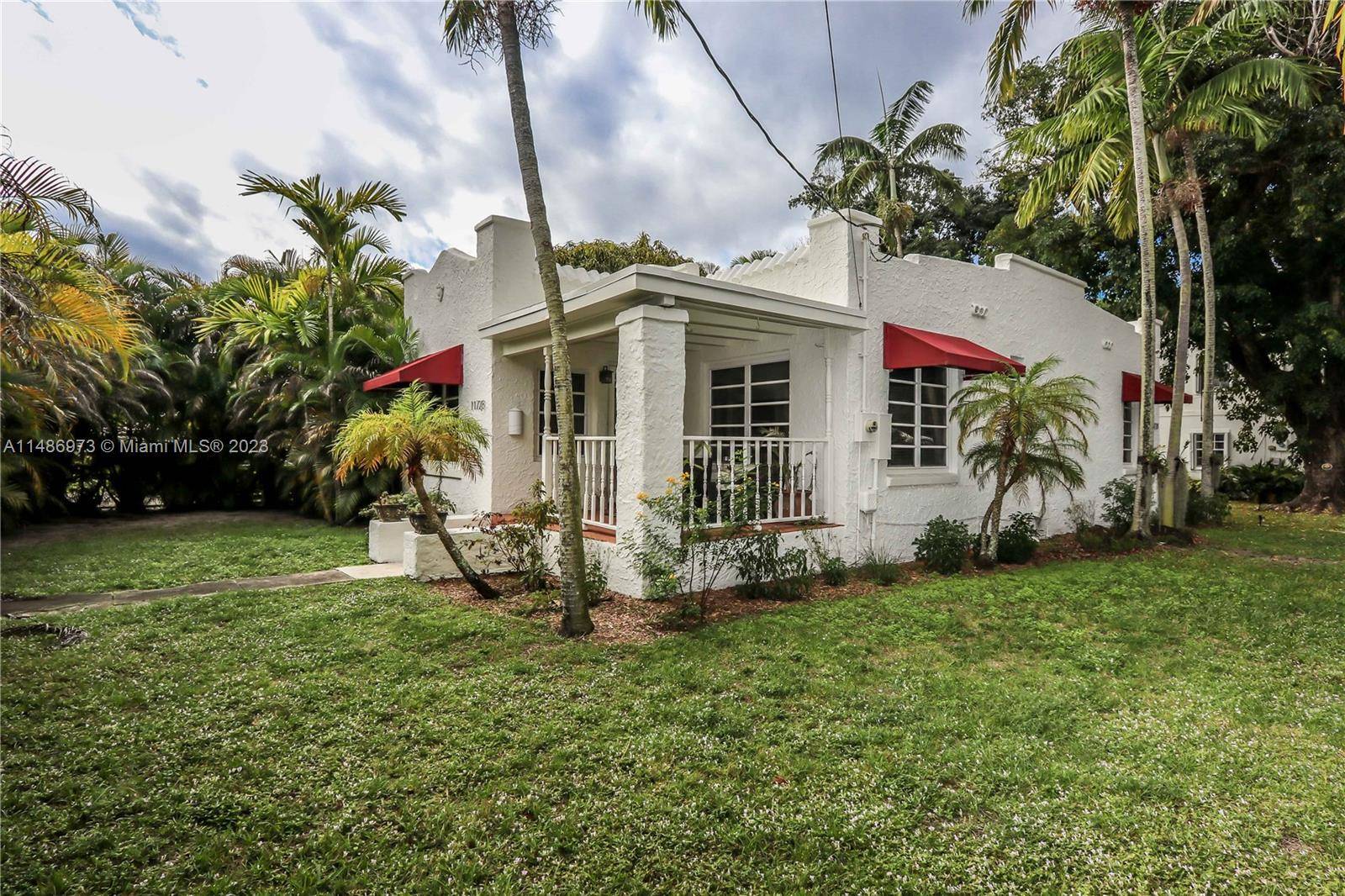 1920s 2Br's 1 Bath with pool surrounded by a Tropical Oasis on Stunning Corner Lot in Biscayne Park.