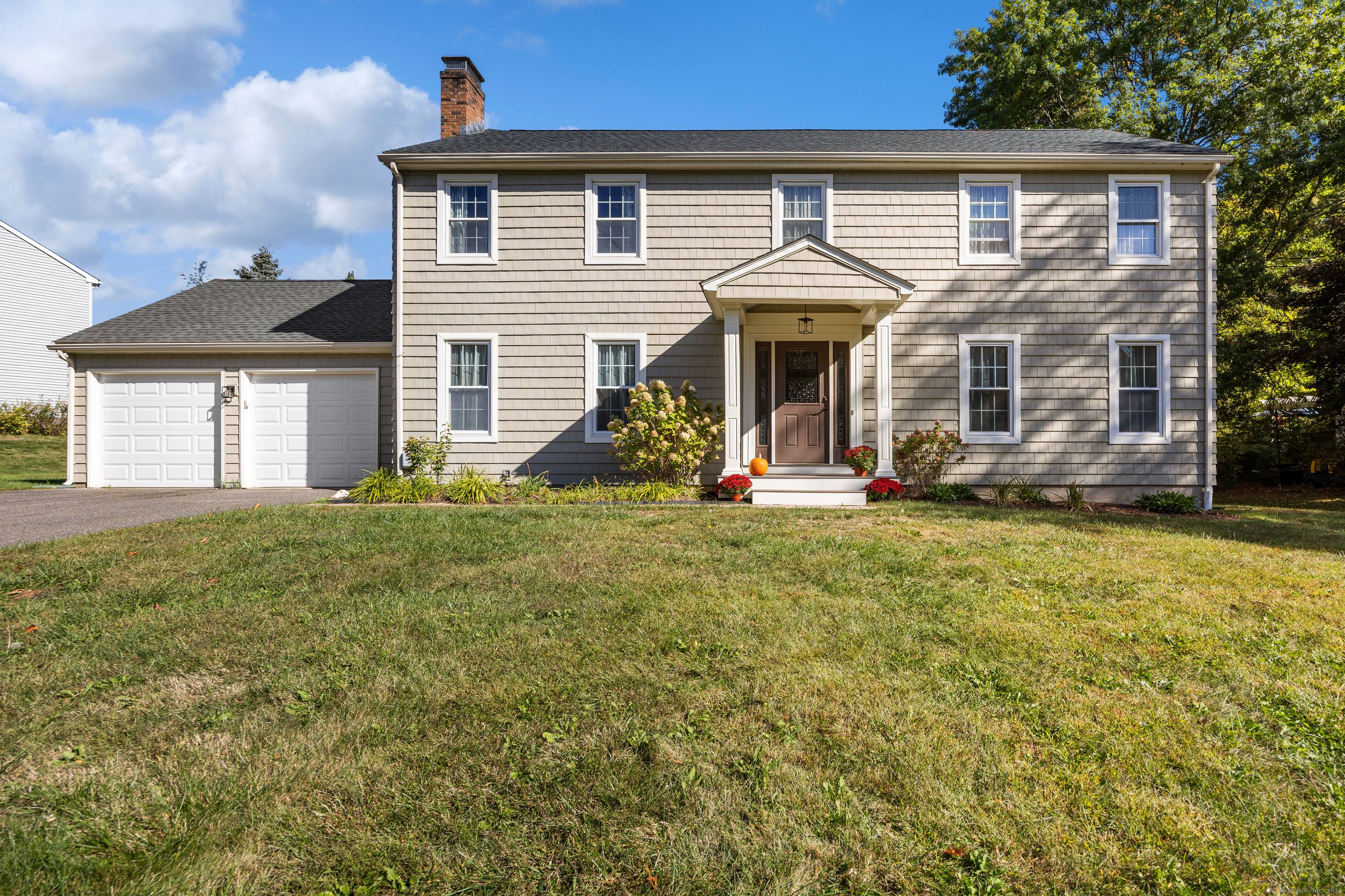 Set in a desirable and centrally located Cheshire neighborhood, this beautifully maintained and updated 4 bedroom, 2.