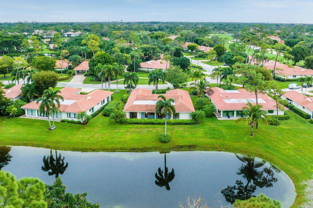 Nestled within lush landscaping and peaceful water views, this stunning villa offers 3 spacious bedrooms and 2 baths, providing an ideal blend of comfort and style.