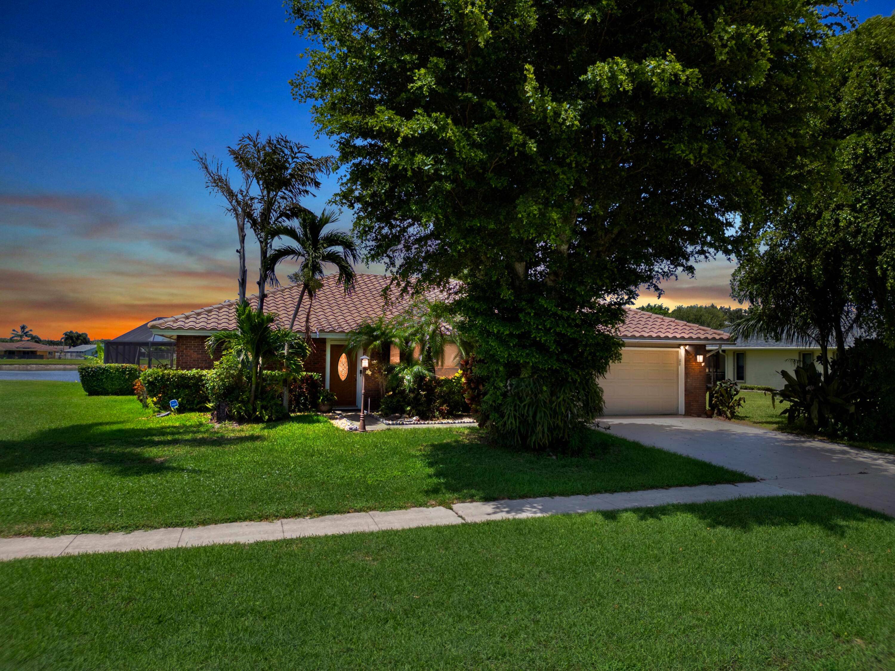Discover this beautiful single family pool home perfectly situated on a tranquil lake in the highly sought after Woodland Creek community.