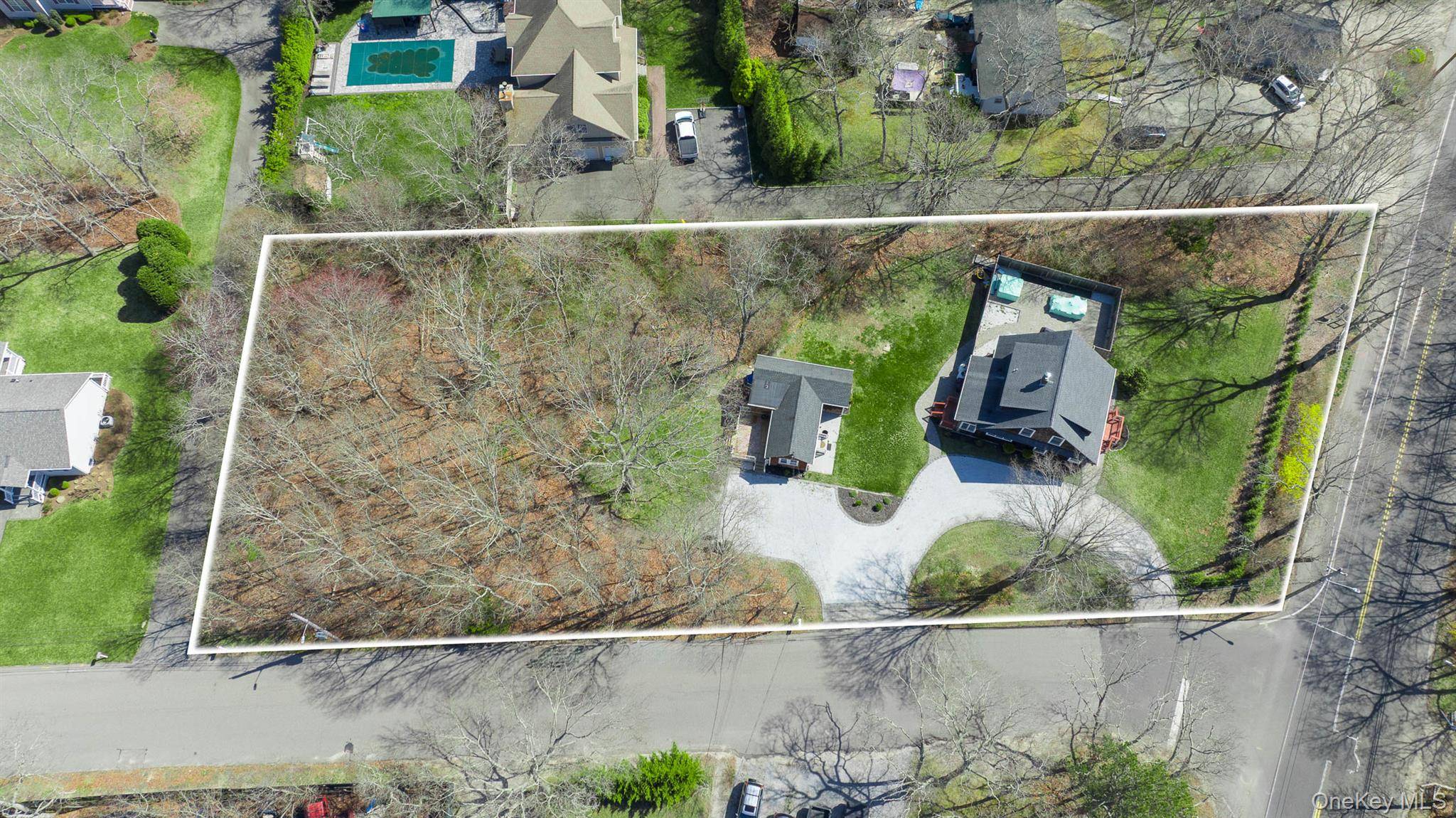 This is just over an acre with TWO houses on it.