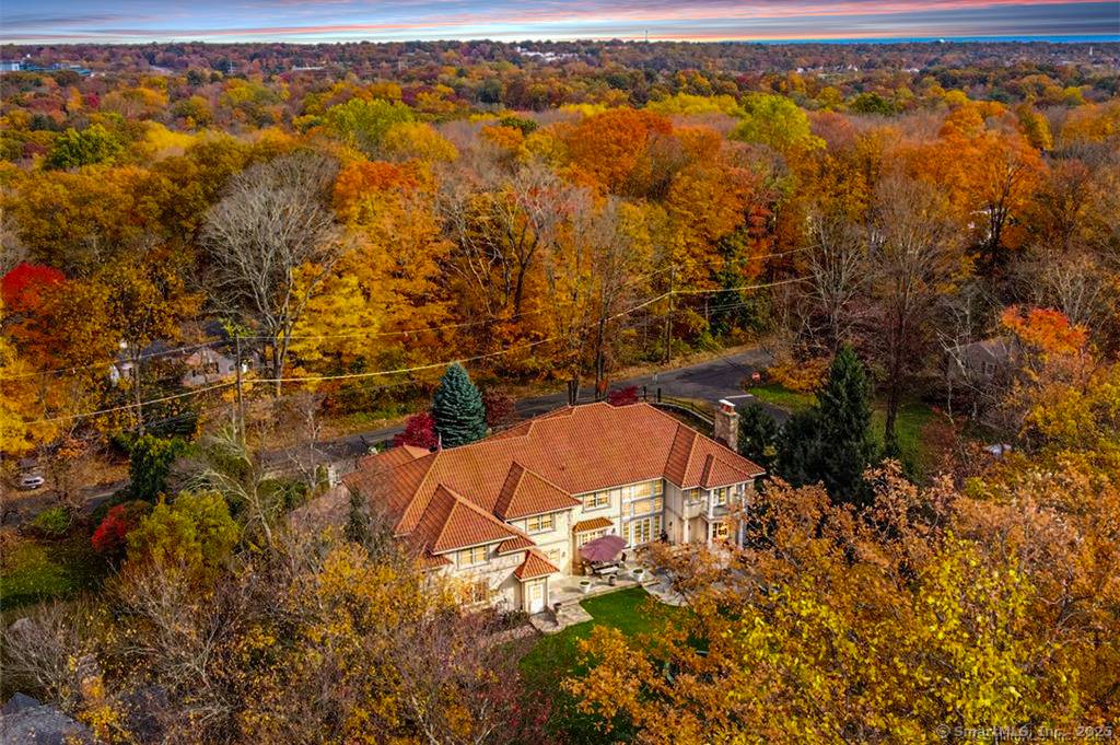 This stunning architectural masterpiece, nestled in the prestigious Silvermine neighborhood, offers nearly 8, 000 square feet of unparalleled luxury.