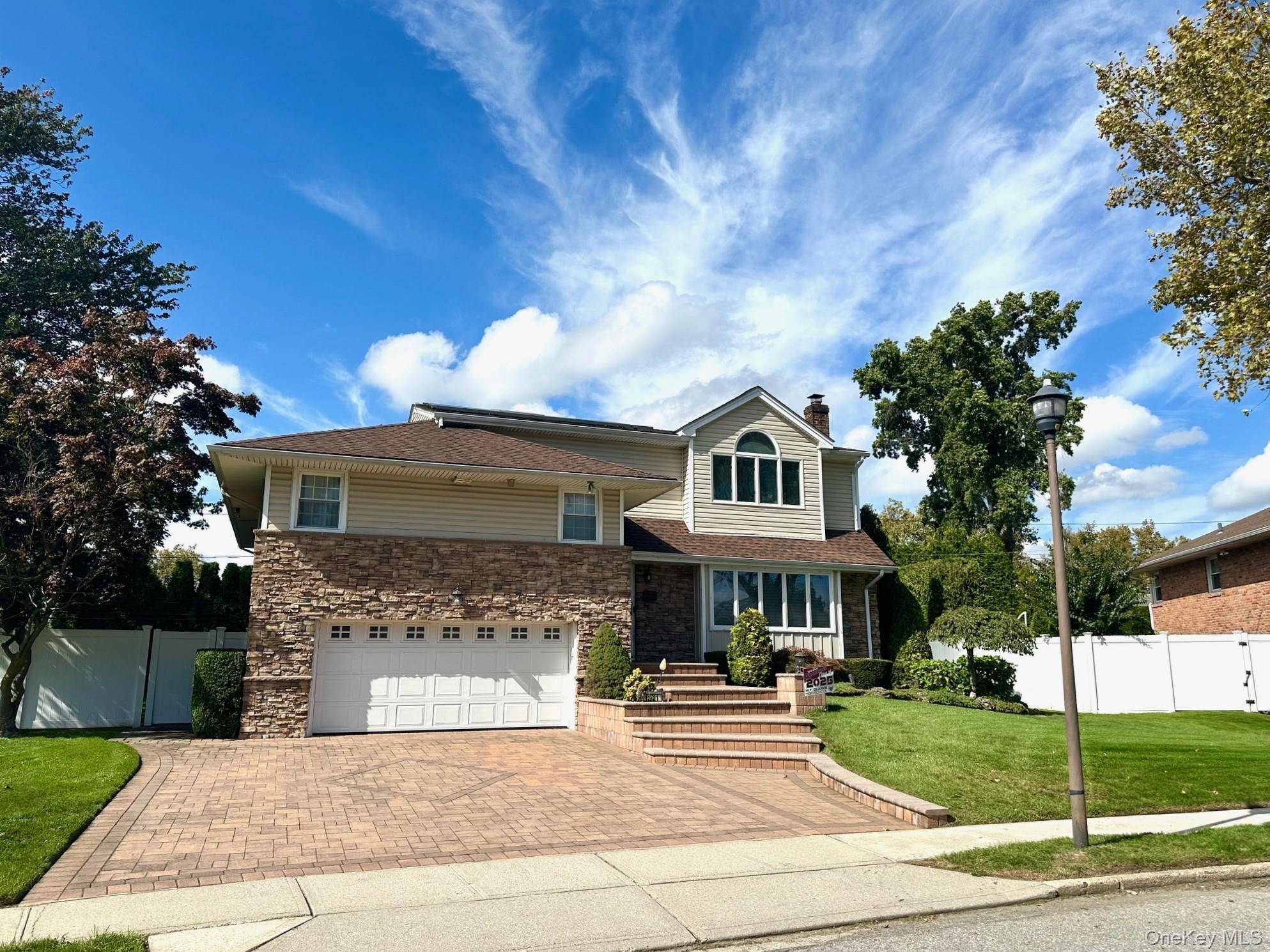 Discover 921 Wellington, a stunning 9 room split level home in the Salisbury Estates of Westbury, within the East Meadow School District.