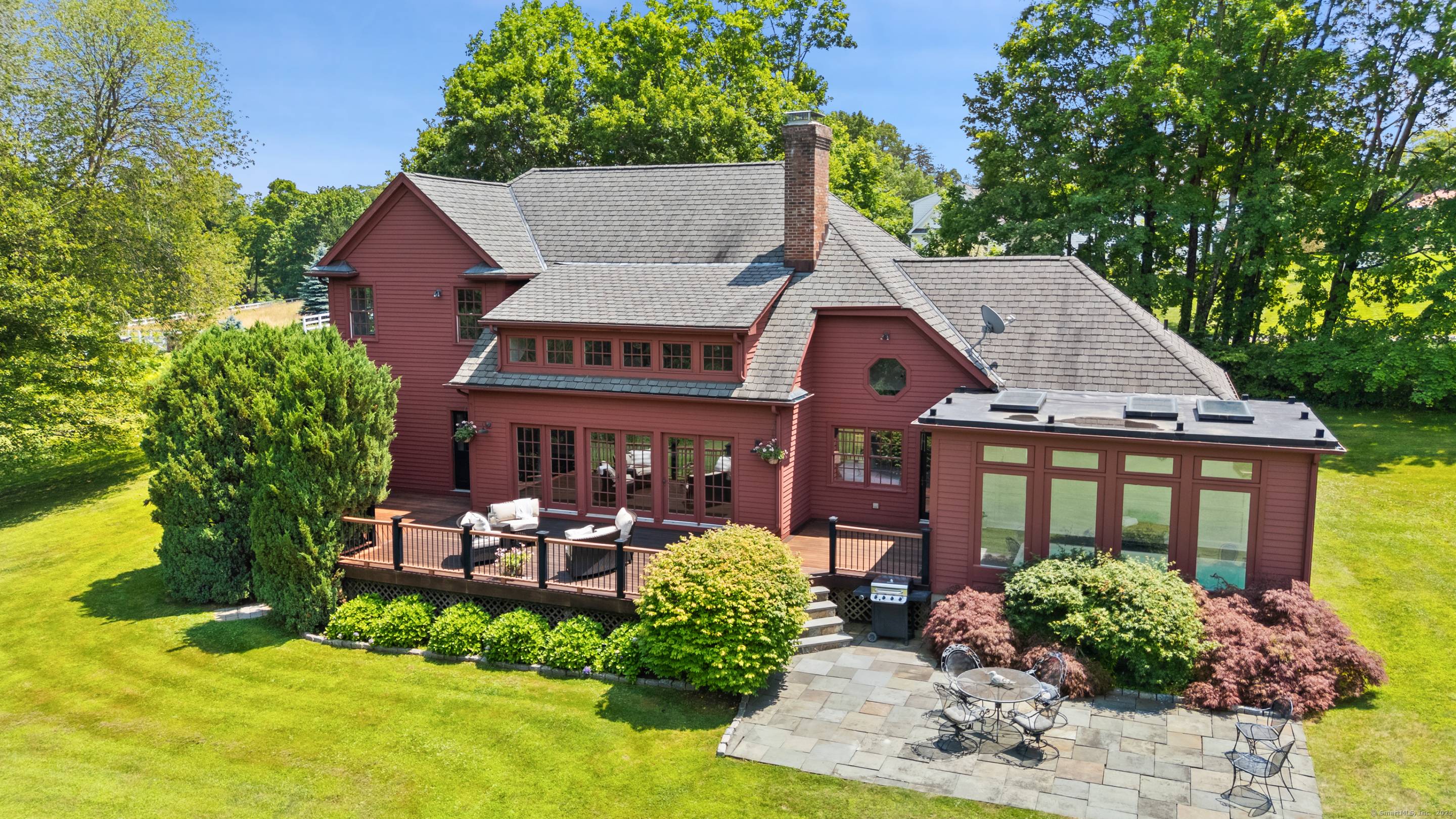 Welcome to Sunset Hill, a timeless yet modern residence set on two level acres in scenic Redding, Connecticut.
