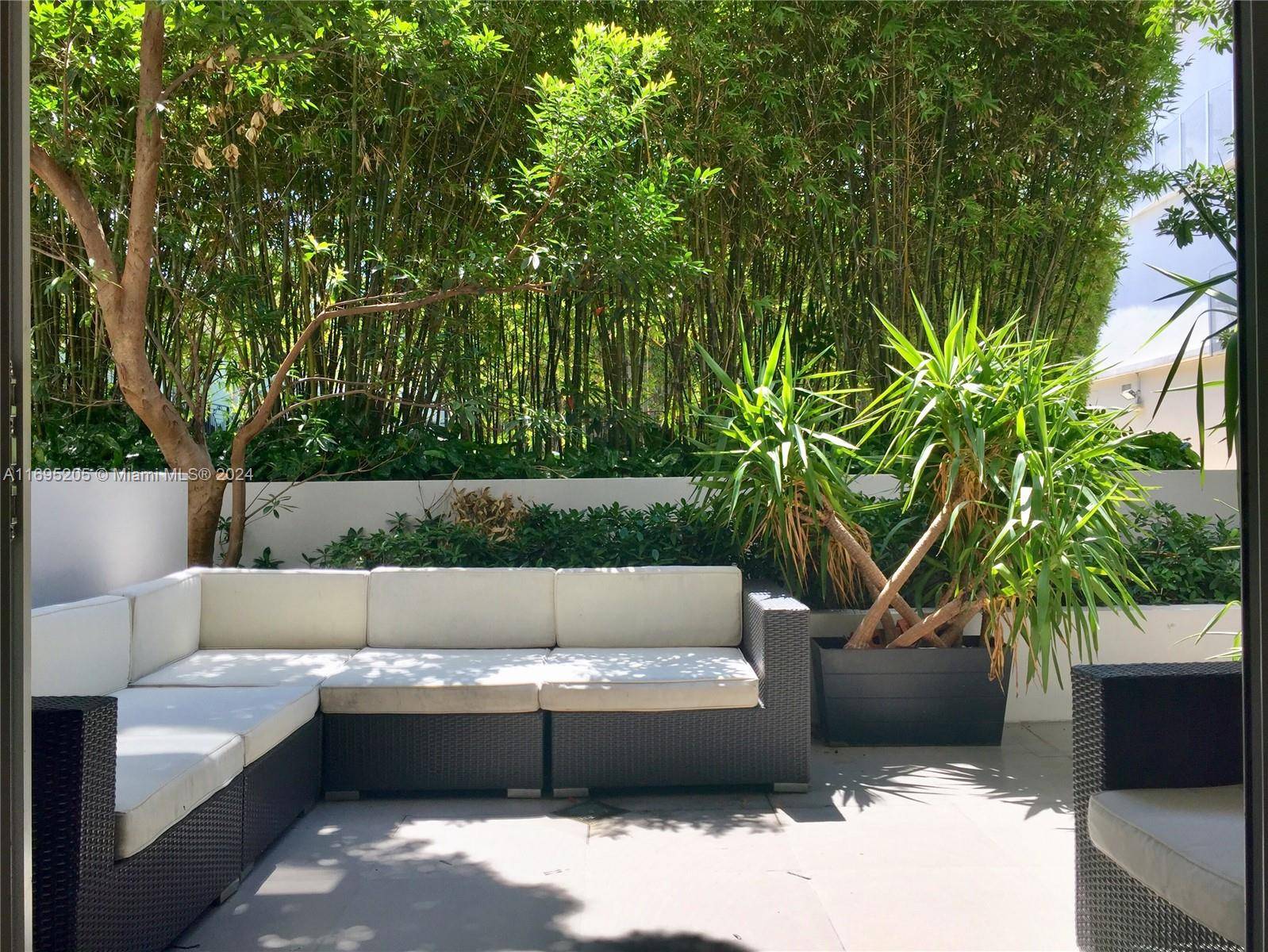Unique opportunity to own this beautiful unique lanai cabana style 1 bedroom 1 amp ; 1 2 bath corner garden unit at Artecity, a secured South Beach guarded community, at ...