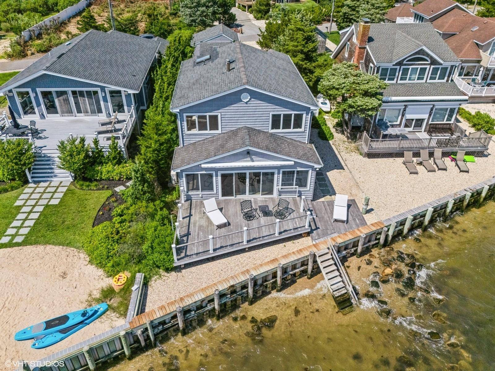 Mattituck, North Fork Bayfront Treasure in Historic Camp Mineola Exceptional Value Private Beach Transferable Rental Permit Jump into the North Fork lifestyle with this captivating bayfront retreat in the charming ...
