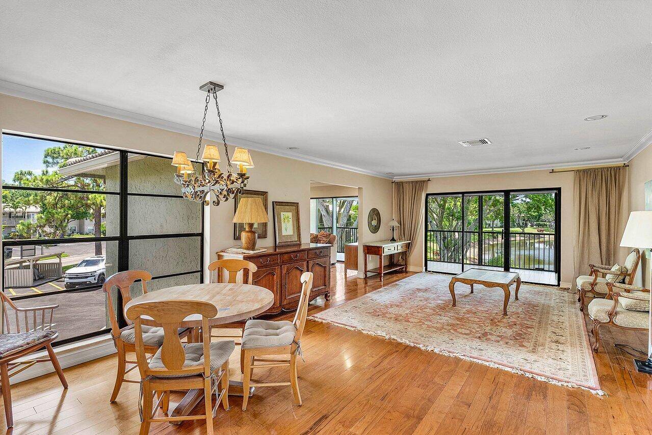 Step into this beautifully furnished condo in the exclusive Hunters Run Country Club in Boynton Beach.