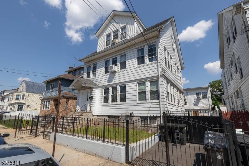 Welcome to an exceptional legal three family residence on serene Isabella Avenue in Newark !