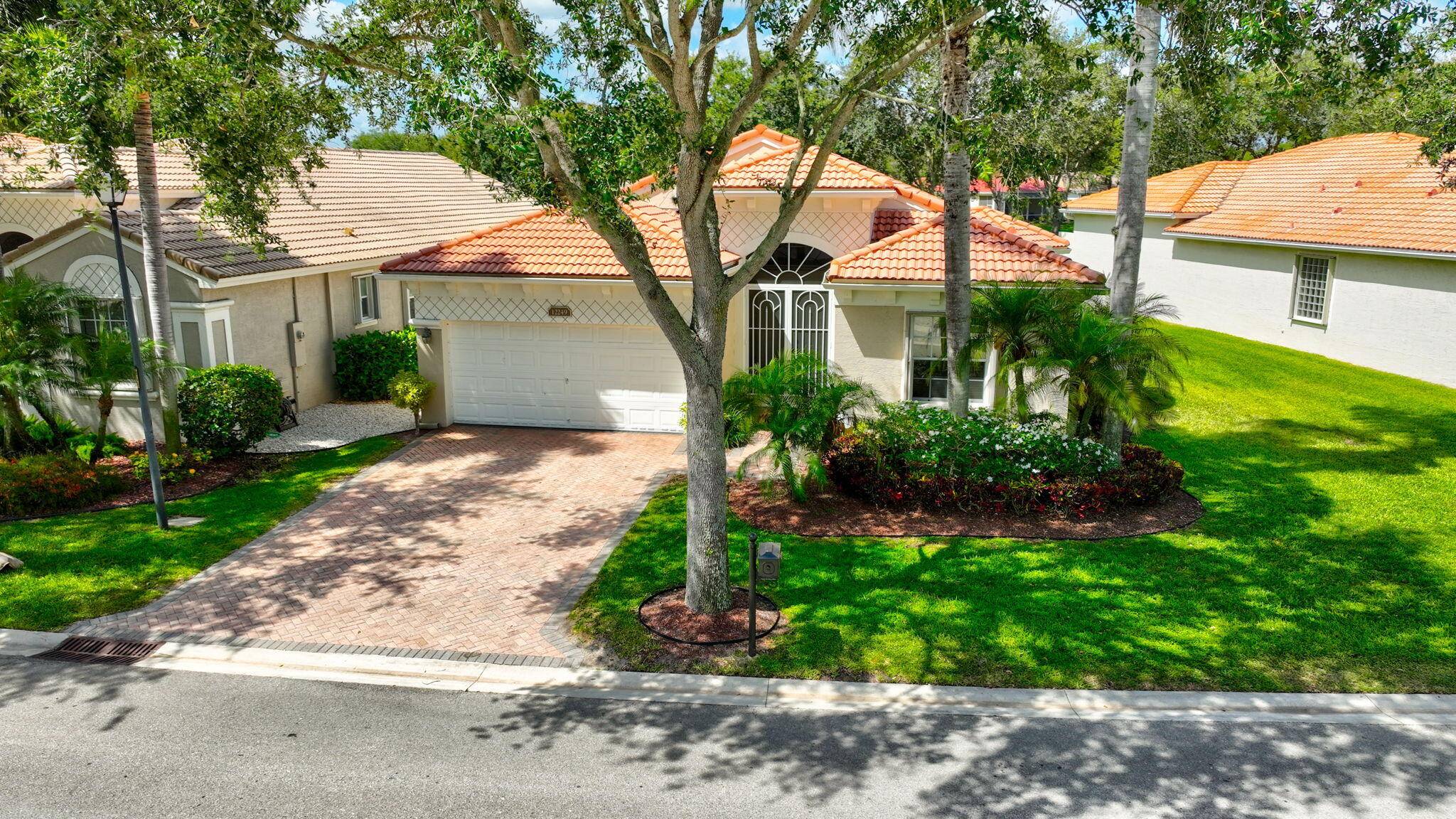 Rare Ascot Model on beautiful upgraded large lake lot offers highly desired SW exposure from back.