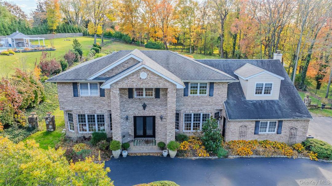 Stately Colonial on nearly an acre of beautifully manicured grounds Located in The Lofts Development in prestigious Dix Hills Area.
