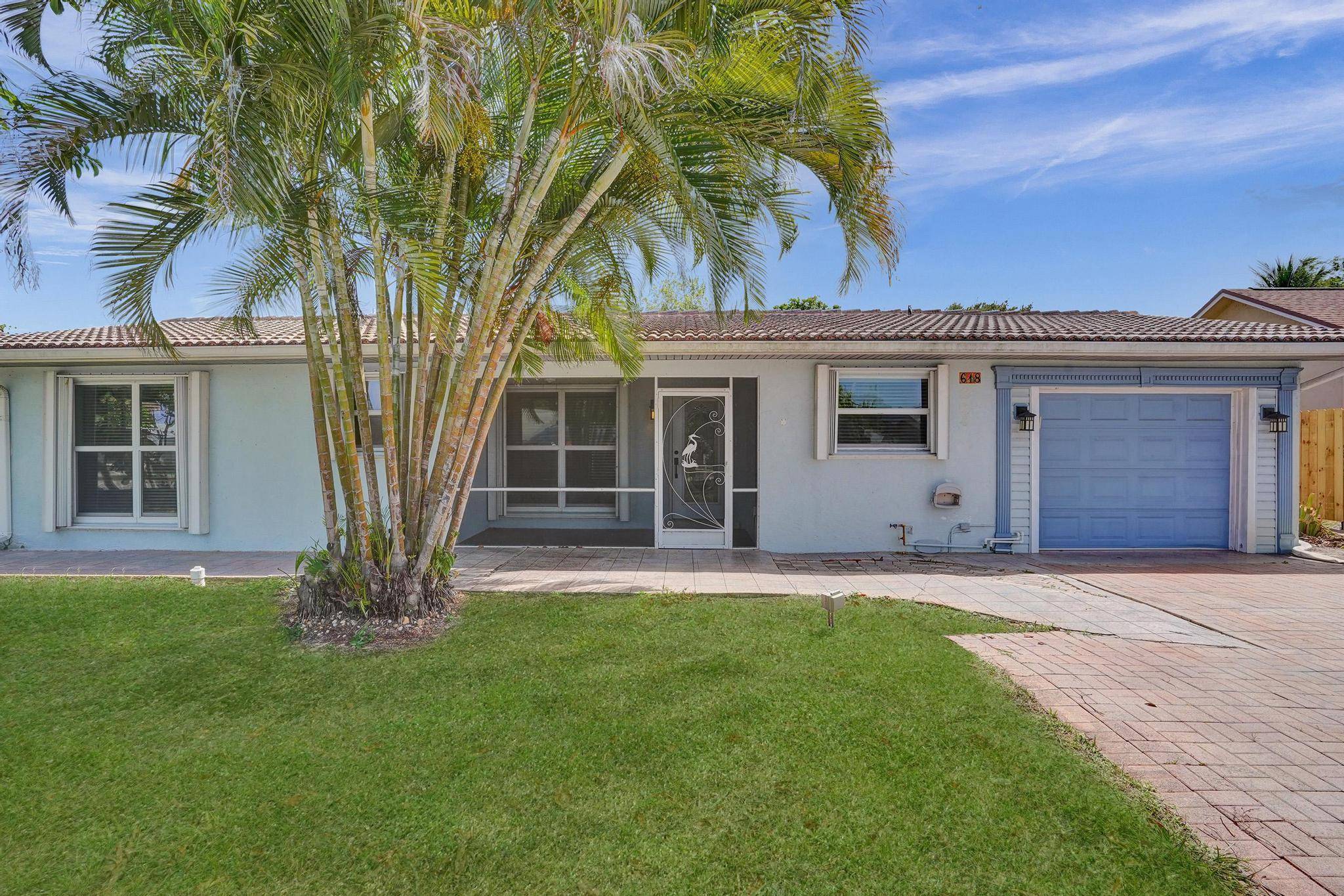 Gorgeous 3 Bedroom, 3 Bath home in highly sought after Tropic Palms, just 1.