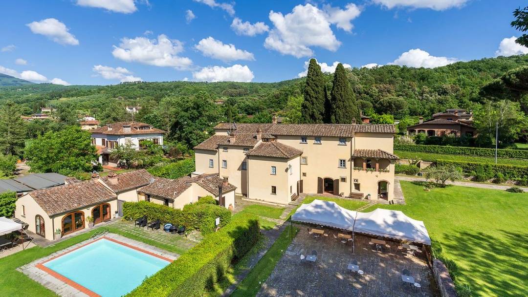 Luxury resort with 11 rooms, 4 suites, 17th-century villa, wellness centre, swimming pool and medieval tower for sale in Arezzo, Tuscany.