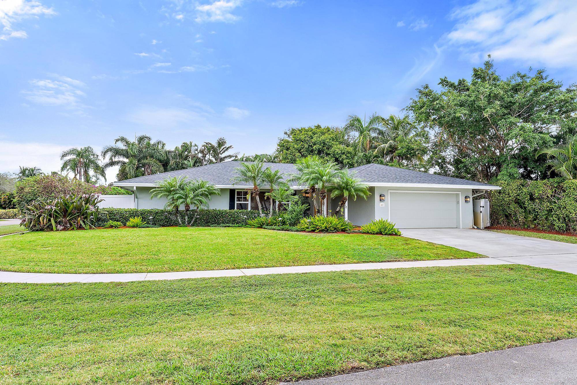 Must See this Beautiful 3 2 Home on oversized corner lot beautifully landscaped with lighting.