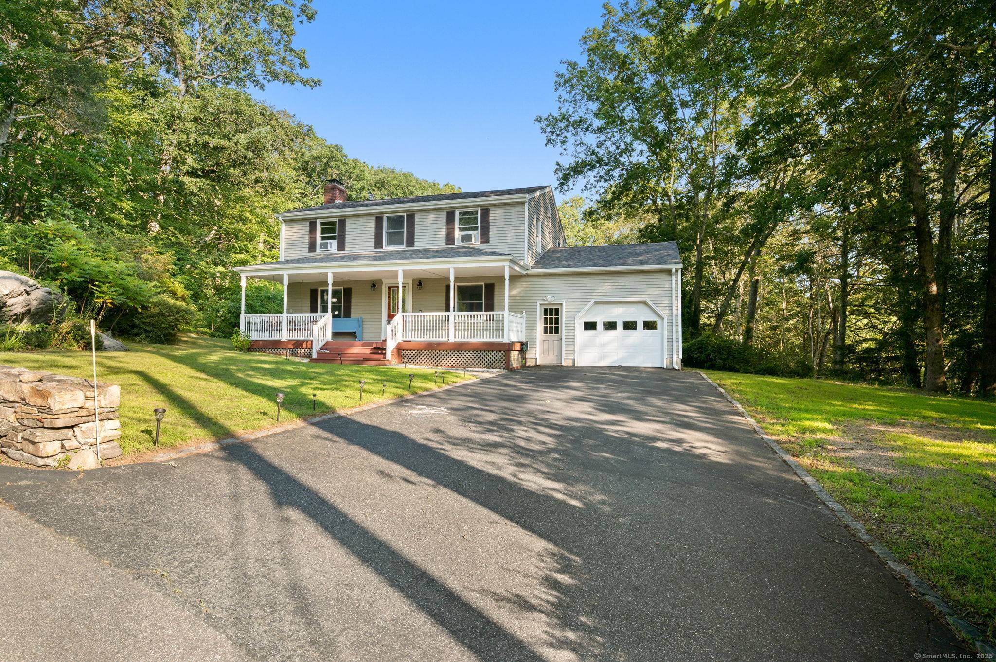 Welcome to this well maintained Colonial set on a private 1.