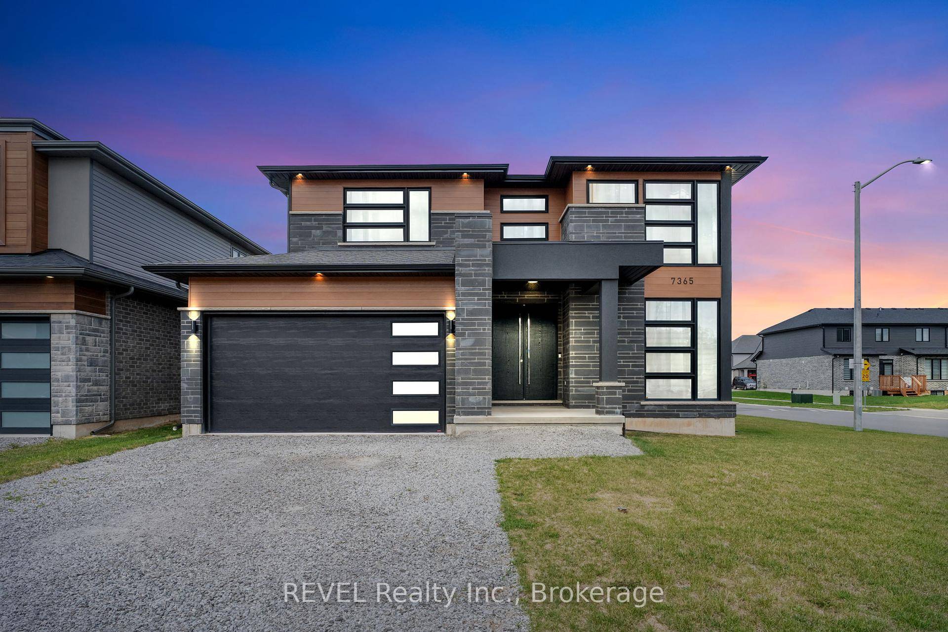 Welcome to 7365 Jonathan Drive, a custom built home that embodies modern elegance and thoughtful design.