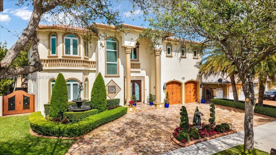 Luxurious estate located within the gated and highly sought after community of Royal Oaks.