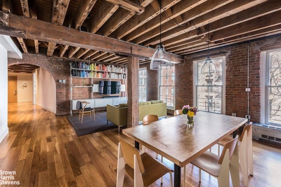 This architecturally stunning two bedroom, two bathroom loft on a prime TriBeCa block features dramatic brick archways, massive columns and rough sawn timber beams.