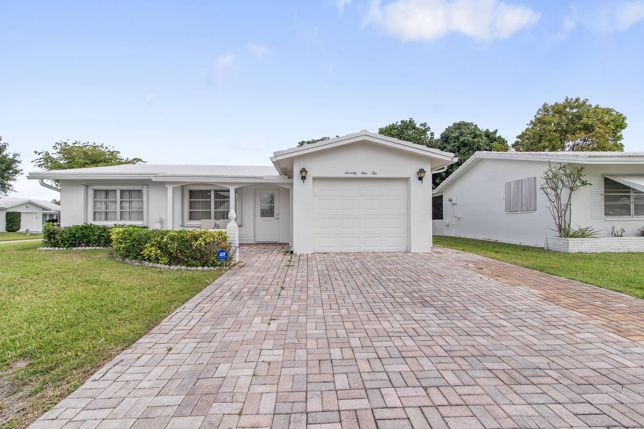 This charming 2 bedroom, 2 bath home, located on a corner lot, features a garage and an inside laundry room.
