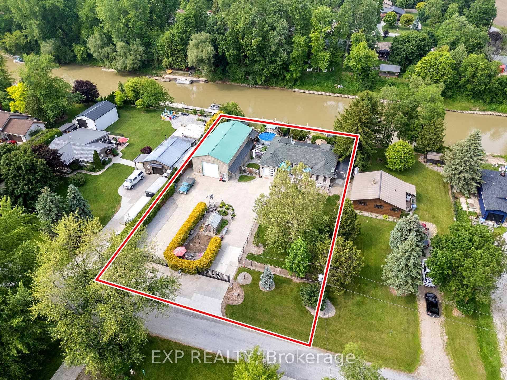 Welcome to 8458 Lazy Lane with two separate gated cement entrances, truly a one of a kind riverfront estate where comfort meets lifestyle on a double lot with spectacular views.