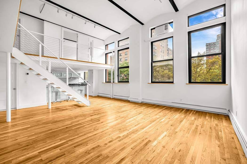 Sun Filled Duplex Loft at Magnolia Lofts This sun drenched duplex loft at the iconic Magnolia Mansion Lofts offers soaring 14 foot ceilings, oversized south facing windows, hardwood floors, and ...