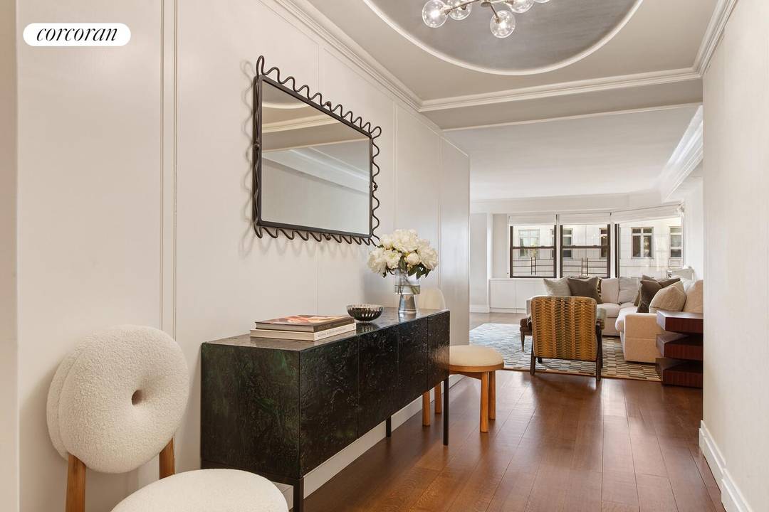 6 rooms 3 beds 3 baths Residence 16ABG, a high floor corner three bedroom in Saxon Towers, offers open east and south exposures, oversized windows, and generous proportions throughout.