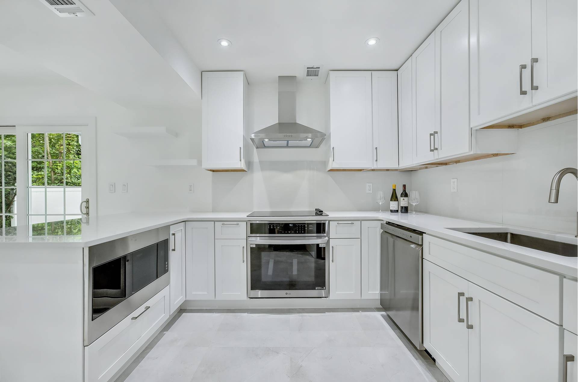 Welcome to a beautifully reimagined home in Brooklyn's exclusive, gated Seagate community.