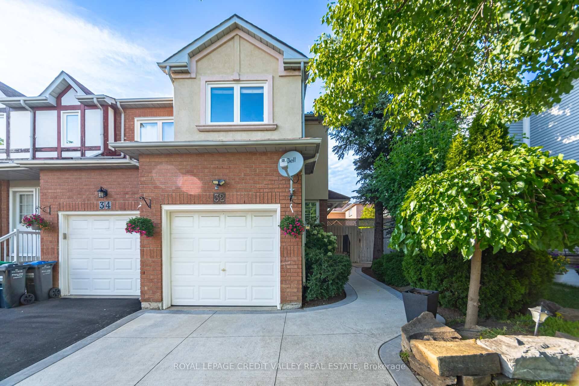 A lovely three bedroom end unit, like a semi detached home with a fireplace, quartz island countertop, stainless steel appliances, pot lights and a finished basement.